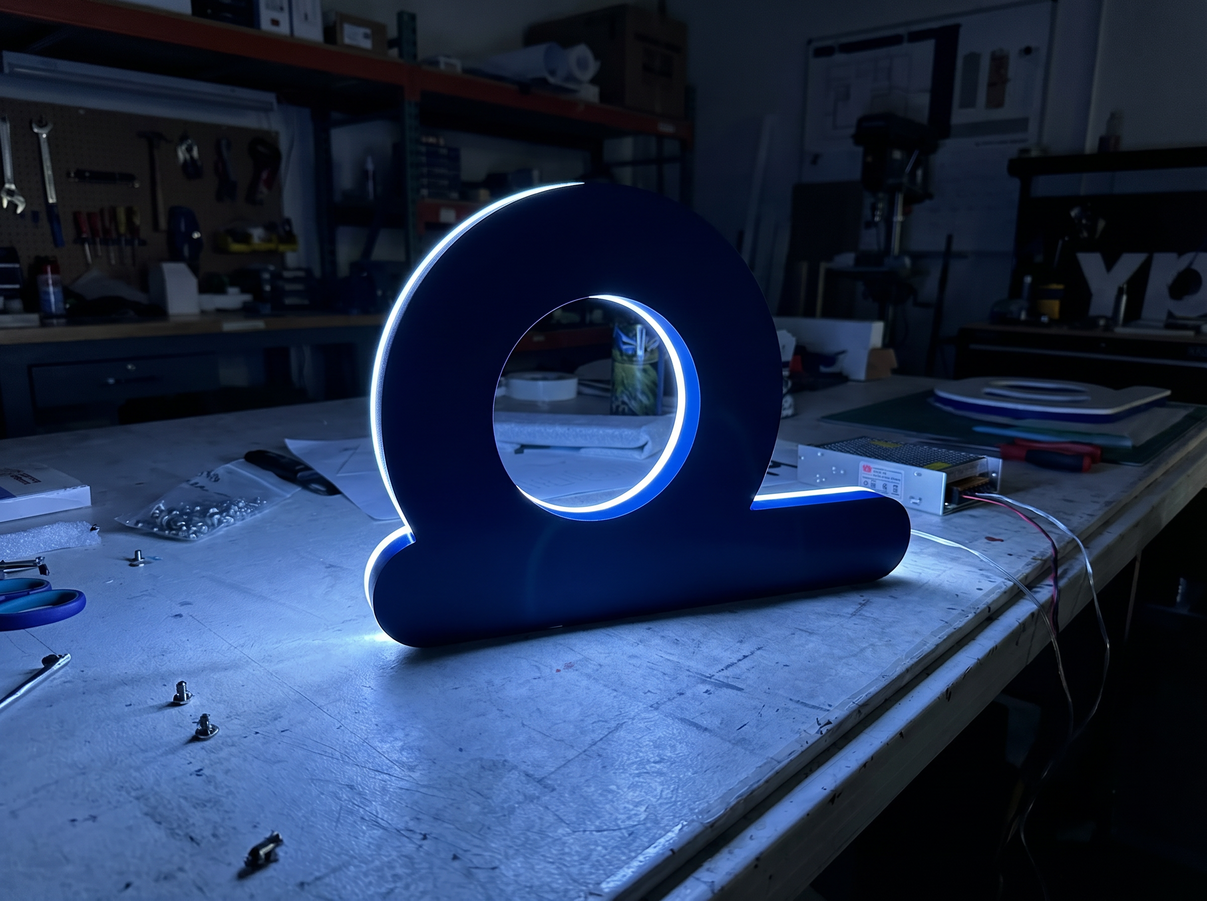 Fabricated illuminated sign letter being tested before dispatch to Melbourne
